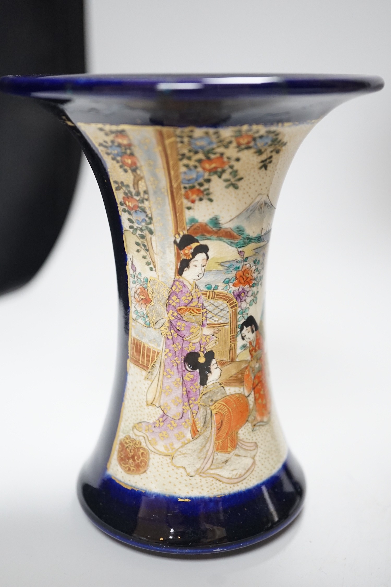 A Japanese Satsuma vase, a smaller vase two saucers and a cat, tallest vase 30cms high